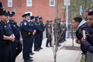 Police hold their ground during the aftermath of the Baltimore Riots. (Erik Hoffman)