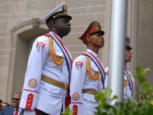 A three-man honor guard prepares to raise the Cuban flag over the country’s embassy in Washington for the first time in 54 years.