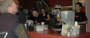 Gary Lew, Joanna Banks and David Yeung share a moment with customers during the lunch rush.