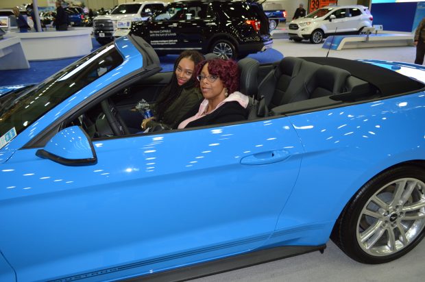 Baltimore women Kieran and Jeanna try out a 2017 Mustang at the Motor Trend International Auto Show in Baltimore (Anthony C. Hayes)
