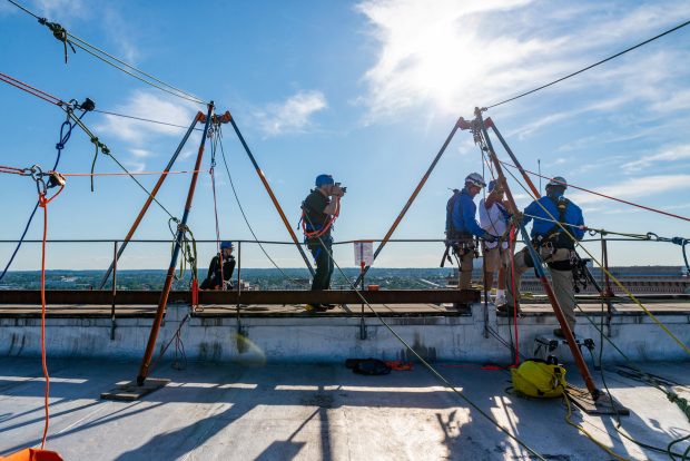 Baltimore, MD - On top of 100 N. Charles Street the experts from Over The Edge, a fundraising group specializing in high angle rigging, prepare Michael Gerlach of Catonsville for his 25 story decent on Friday June 14, 2019. Gerlach is Executive Producer and Host of ÒInsight on DisabilityÓ radio show on WCBM talk radio AM 680.This is his fifth year going over the edge for the Rappel for Kidney Health event.