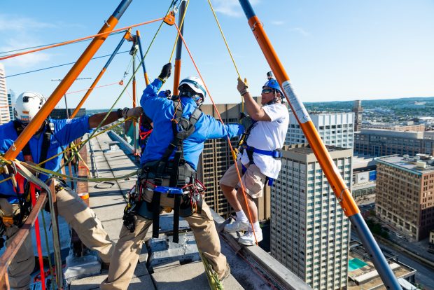 Baltimore, MD - On top of 100 N. Charles Street the experts from Over The Edge, a fundraising group specializing in high angle rigging, prepare Michael Gerlach of Catonsville for his 25 story decent on Friday June 14, 2019. Gerlach is Executive Producer and Host of ÒInsight on DisabilityÓ radio show on WCBM talk radio AM 680.This is his fifth year going over the edge for the Rappel for Kidney Health event.