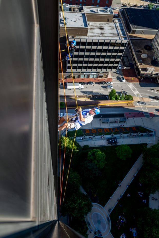 Baltimore, MD - Michael Gerlach of Catonsville begins a 25 story decent down the side of 100 N. Charles Street on Friday June 14, 2019 during the 10th Annual Rappel for Kidney Health event. Gerlach is Executive Producer and Host of ÒInsight on DisabilityÓ radio show on WCBM talk radio AM 680. This is his fifth year going over the edge for the Rappel for Kidney Health event.