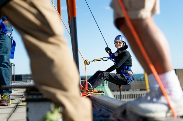 Baltimore, MD - Joanne, A event volunteer, prepares to descend the 25-story building along side Michael Gerlach of Catonsville on Friday June 14, 2019.