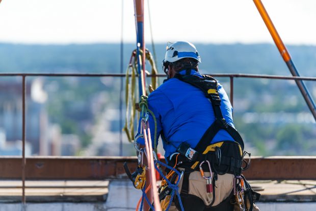 Baltimore, MD - Marc Tiritilli from Over the Edge, a fundraising group specializing in high angle rigging, works on high angle rigging on top of 100 N. Charles Street Friday June 14, 2019.