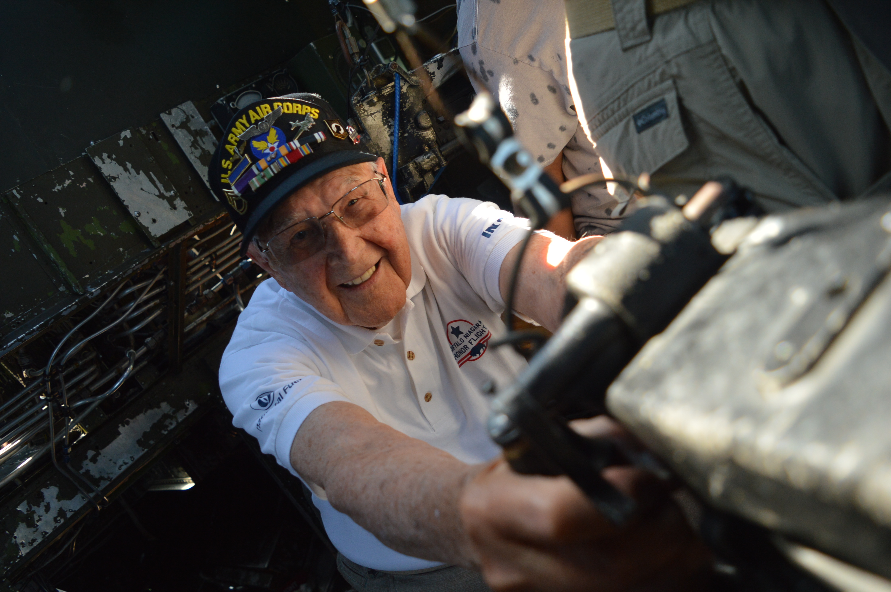 WWII veteran "Casey" Bukowski takes careful aim during his memorable flight aboard "The Movie" Mephis Belle. Casey took a ride during the 2019 Geneso Airshow at the Natinal Warplane Museum.(Anthony C. Hayes)