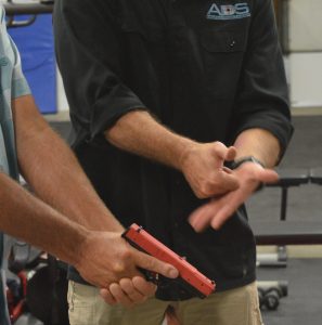 Concealed carry in Maryland: Joe Lynch of Annapolis Defense & Security instructs a student in the proper use of a handgun. (Anthony C. Hayes)