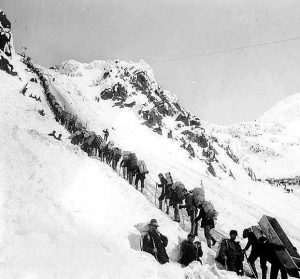 Klondikers carrying supplies ascending the Chilkoot Pass, 1898 (Library Washington University)