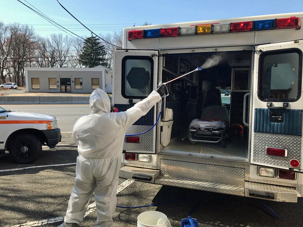 A service technician from Delaware-based National Restoration applies a disinfecting spray fog to the interior of an ambulance. National Restoration has launched a dedicated Coronavirus Disinfection Division. (courtesy)