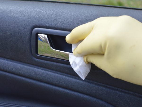 Using disinfecting wipes for cleaning a car of COVID-19 coronavirus