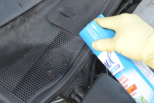 Coronavirus cleaning: spraying Lysol into the air vents of a 2005 VW Passat