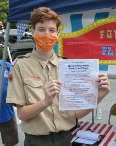Boy Scout flag burning retirement ceremony: Star Badge scout Wyatt Sponseller with a flier for this weekend's flag retirement ceremony. (Anthony C. Hayes)