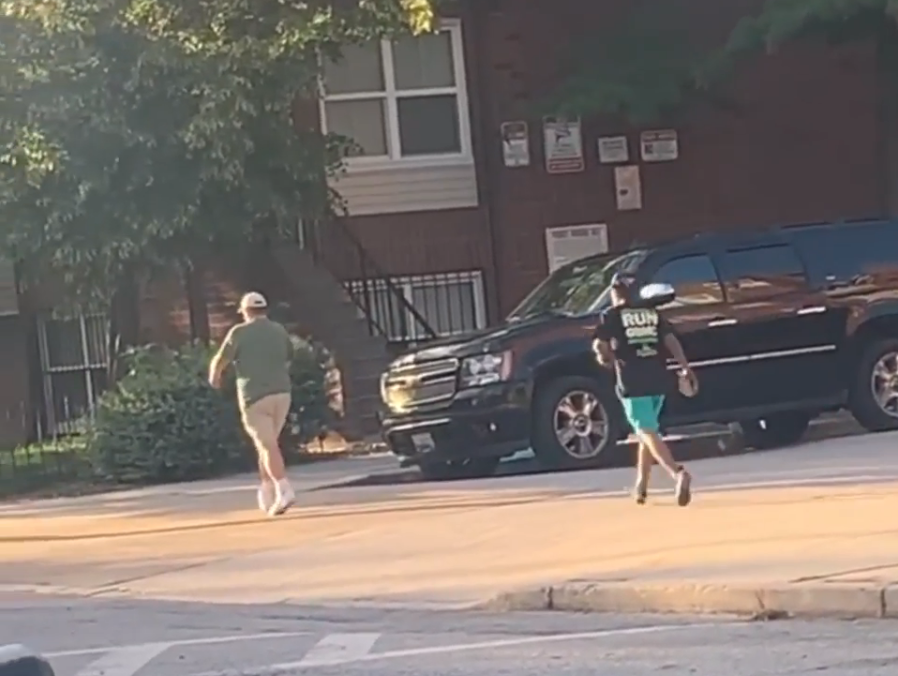Assault in Baltimore: A screenshot from Instagram showing an individual with what appears to be a cement block in his hand running up behind an unsuspecting victim.