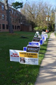 Vote: Campaign signs outside a voting center at Dickey Hill Elementary School in Baltimore City. (Anthony C. Hayes/BPE)