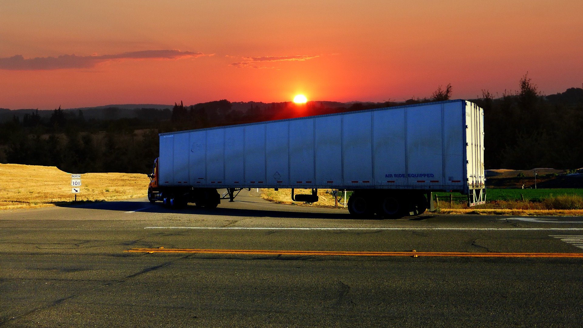 Truck trailer at sunset: credit RENE RAUSCHENBERGER from Pixabay