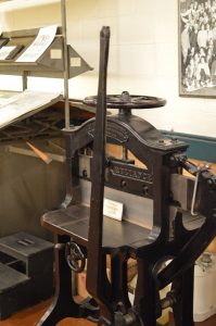 An old-school press in the print shop at the BMI. (credit Anthony C. Hayes)