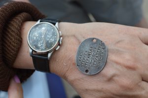 TBM Avenger flight: Lynn Stepanian-Smith shows us the watch and dog tag of her late father, U.S. Navy aviator Edward Stepanian. (credit Anthony C. Hayes/BPE)