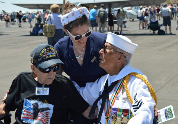 Reenactor Alexandra Pinamonti stops to greet veterans Victor Marulli and Fame Academia. (credit Anthony C. Hayes)