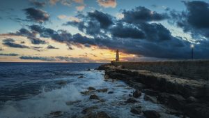 Sky sea and lighthouse credit umutizgi at Pixabay