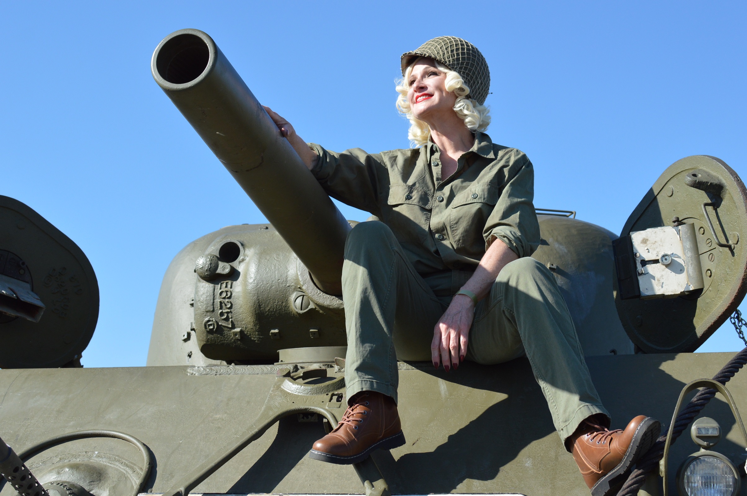 "Dietrich" actress Cindy Marinangel aboard the M4A2 Sherman tank "Battling Bitch II" at the 2022 MAAM WWII Weekend. (credit Anthony C. Hayes)