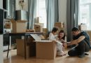 Family of three unpacking after moving to a new neighborhood in Rockville.