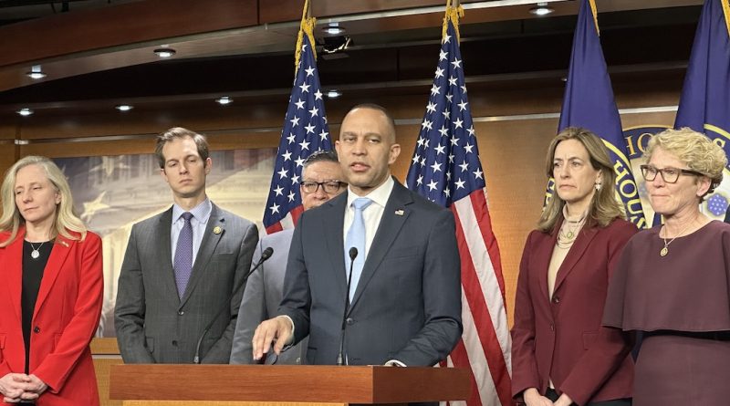 WASHINGTON - House Minority Leader Hakeem Jeffries, D-N.Y., speaks to reporters Tuesday about aid to Ukraine and Israel. To the left of Jeffries are Democratic Reps. Abigail Spanberger of Virginia, Jake Auchincloss of Massachusetts and Salud Carbajal of California. To the leader's right are Democratic Reps. Mikie Sherrill of New Jersey and Chrissy Houlahan (in glasses) of Pennsylvania. (Katharine Wilson/Capital News Service)