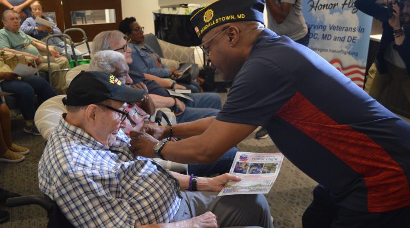 Honor Wall: Atrium Village resident Marty Zuckerman receives his pin from William Beverly, Commander of American Legion Post 122.