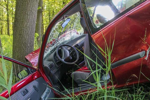 red car in ditch after crash