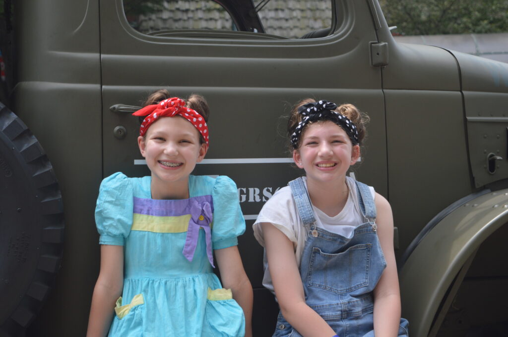 MAAM World War II Weekend 2025: Two young parade-goers get into the spirit of the day. (credit Anthony C. Hayes)