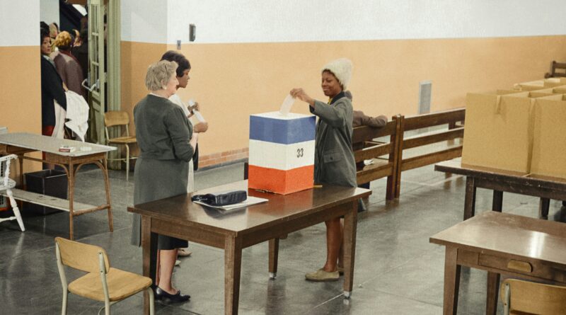 Negro voting in Cardoza [i.e., Cardozo] High School in [Washington,] D.C. / [MST]." Original black and white negative by Marion S. Trikosko. Taken November 3rd, 1964, Washington D.C, United States (@libraryofcongress). Colorized by Jordan J. Lloyd. Library of Congress Prints and Photographs Division Washington, D.C. 20540 USA https://www.loc.gov/pictures/item/2003688167/
