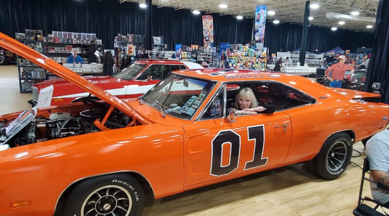 Lost in Space star Marta Kristen relaxing in the General Lee at a nostalgia show in Detroit (credit Timothy Montie)
