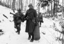 Army engineers emerge from defensive positions in the vicinity of Bastogne, Belgium, after fighting in the Battle of the Bulge. (US Army photo)