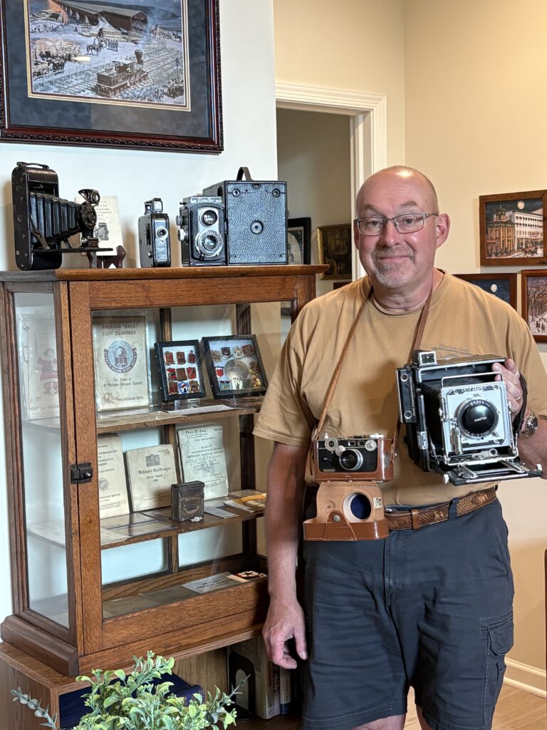 MAAM WWII Weekend 2026: Lititz PA resident Tom Jordan at home with his vintage camera collection.