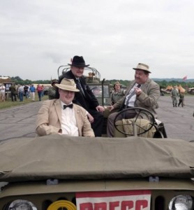 Abbott and Costello (Bill Reily and Joe Zeigler) and Scoop Fields (Jason Crutchley) bum a ride with the press (Lady Camille) 