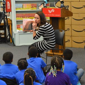 Heidi Daniel entertained the thoroughly-engaged children with two “story-time” readings at the Prattl Library Amazon STEM donation event. (Anthony C. Hayes)