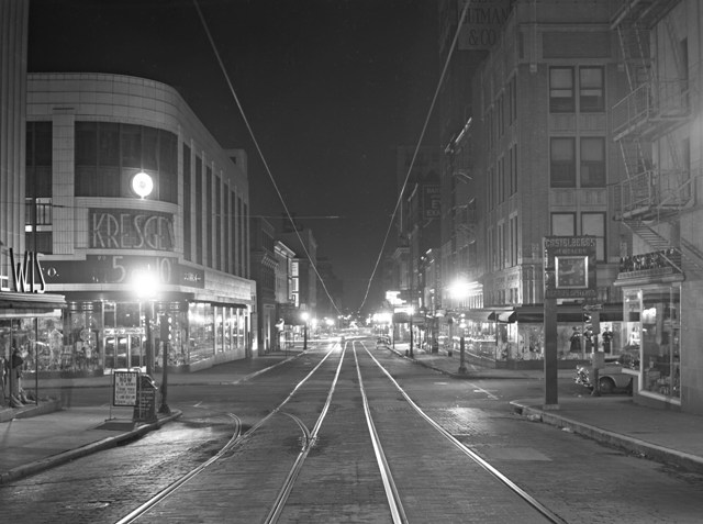 Trolley car tracks and power lines are visible in this brightly lit photo of Lexington Street from the BGE Collection.