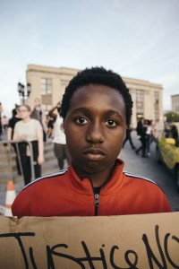 Portrait of young demonstrator during student led protest taken by Jack Flame Sorokin, April 19, 2015