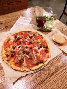 A Meat Lovers pizza with black olives and garlic sauce along with a beet salad and nicely warmed s'more. (Anthony C. Hayes)