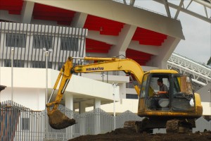 A Chinese worker operates a bulldozer amid construction of San José's national soccer stadium — a gift from the Chinese government after Costa Rica recognized China in 2007 and broke relations with Taiwan. (Larry Luxner)