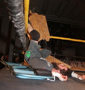 Devon Moore barely survived an Exploder Suplex through a barbed wire board. (Lyle C. Williams)