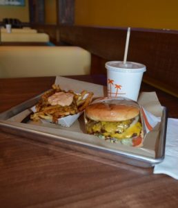 A Cali Double burger with Cali fries and a chocolate milkshake. (Anthony C. Hayes)