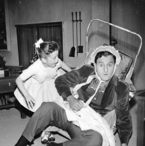 Danny Thomas and his television daughter, Angela Cartwright, play house in this publicity photo from the television program, Make Room for Daddy. (Wikimedia)