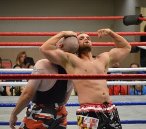 Flexing his muscles in a losing cause, Aplollo Cruz prepares to flip Bill Ward. (Anthony C. Hayes)