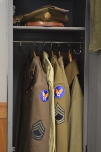 WWII-styled uniformes in a locker at Ft. Indiantown Gap. The Garrison will now also require that reenactors in leadership capacities adhere to Army standards of certification for non-commissioned officers and officers.  (Anthony C. Hayes)