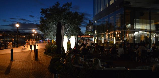 Loch Bar diners make merry on a warm summer evening in Harbor East in Baltimore, MD. (Anthony C. Hayes)