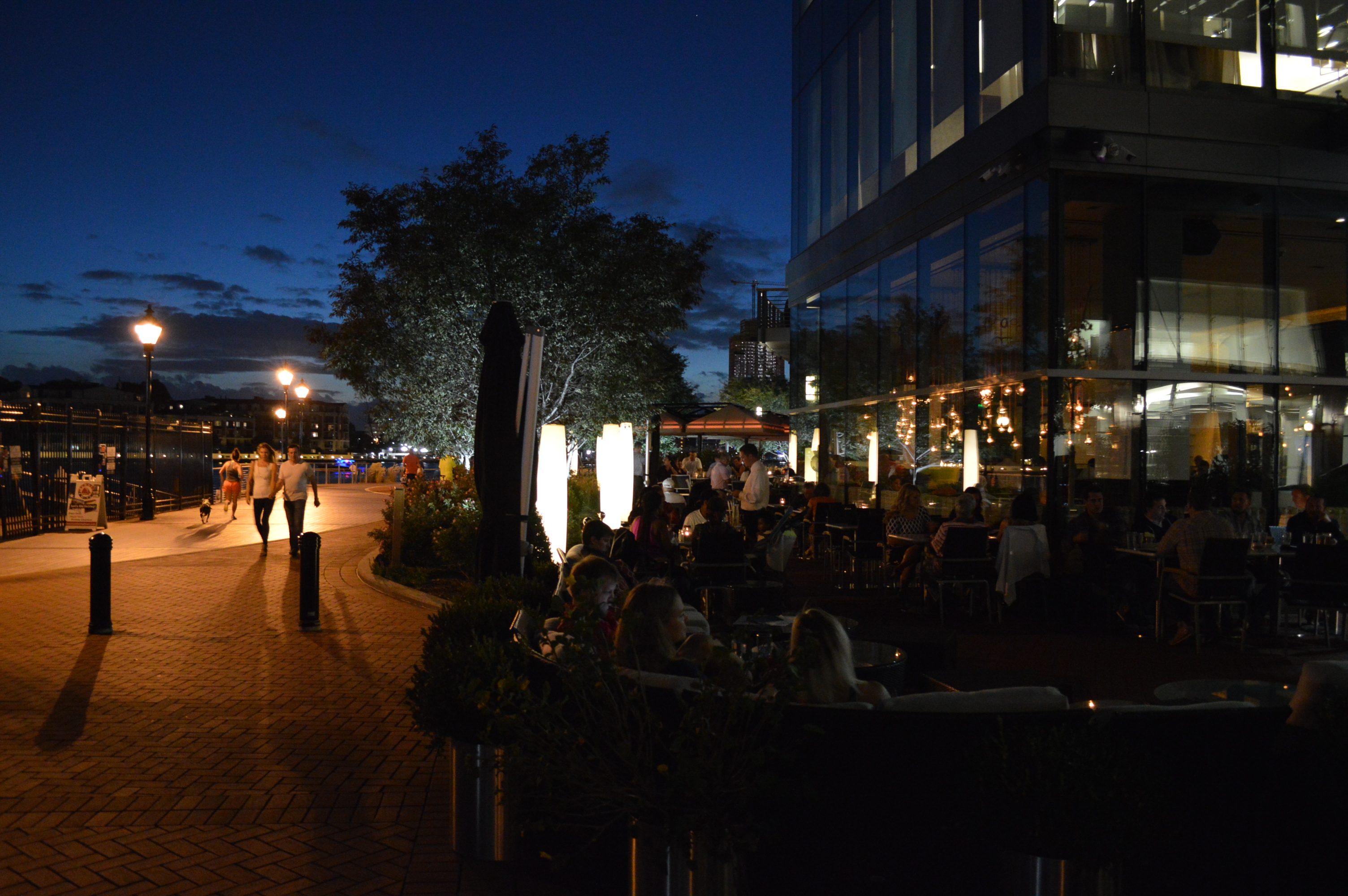 Loch Bar diners make merry on a warm summer evening in Harbor East in Baltimore, MD. (Anthony C. Hayes)