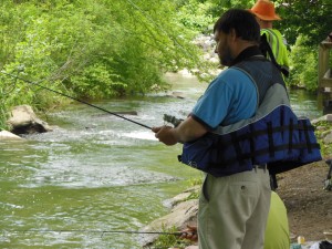 Derby participant Carlos volunteered to catch fish for his friends.  (Anthony C. Hayes)