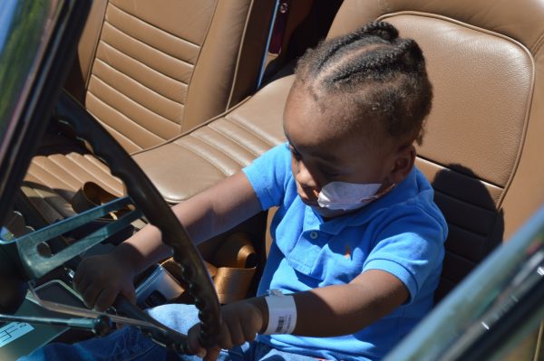 A little boy behind the wheel of a 1967 Corvette. On Saturday, July 7, 2018, the Mason-Dixon Chapter of the National Corvette Restorers Society (NCRS) paid its annual visit to the Mt. Washington Pediatric Hospital in Baltimore (credit Anthony C. Hayes).