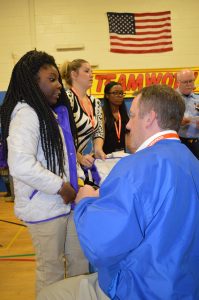 Forty-five employees of Horizon Services traveled from Wilmington,Delaware to help fit students with new winter coats. (Anthony C. Hayes)