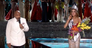 Host Steve Harvey walks to the front of the stage to announce he’s made a mistake. Gutierrez is clearly confused.